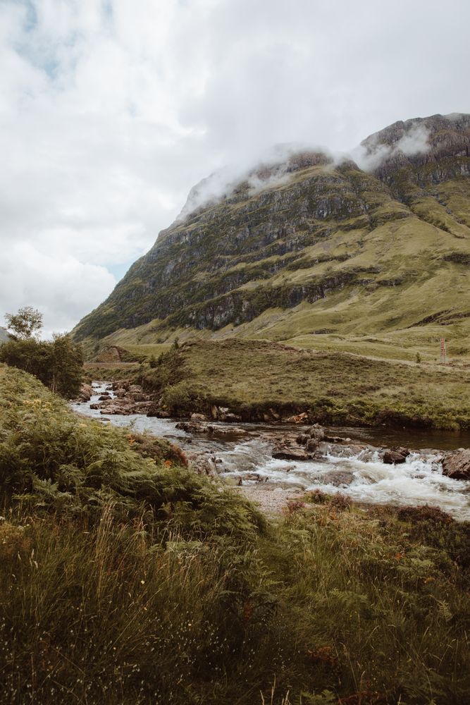 Mountain river with stones on daytime