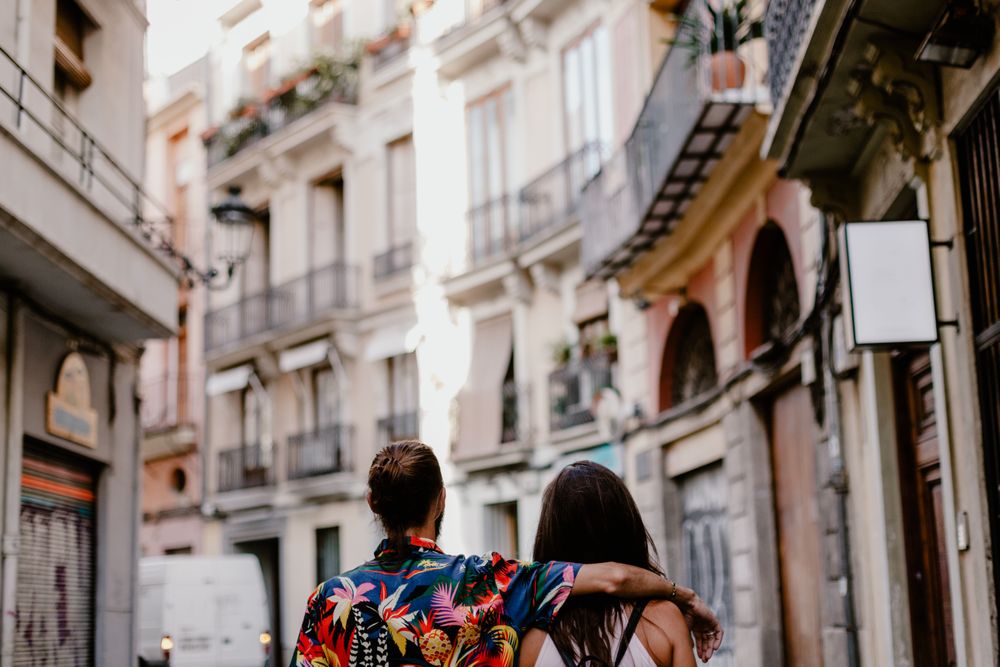 Embracing couple strolling in old city