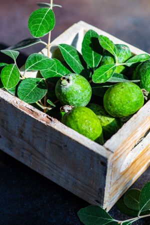 Box of fresh organic fruit feijoa