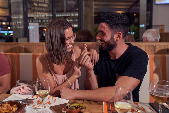 Cheerful couple sitting in restaurant