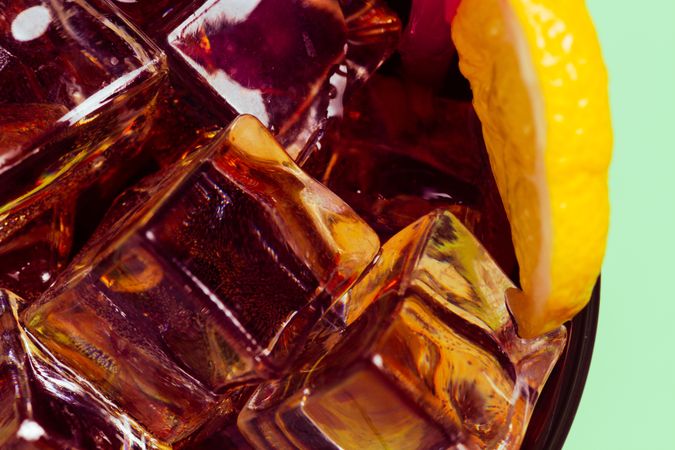 Drink in glass with ice and lemon