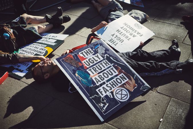 London, England, United Kingdom - September 15th,2019: People laying separately with protest signs
