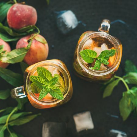 Top view of orange cocktails in mason jars with garnish