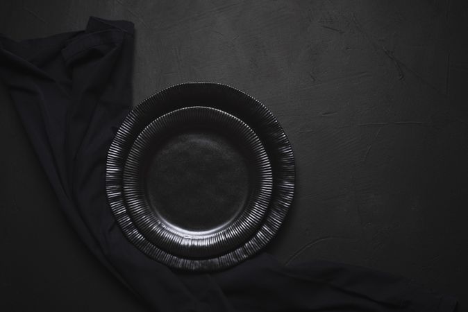 Empty dark plates and napkin
