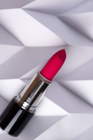 Red lipstick on raised chevron, Product and make up contemporary concept