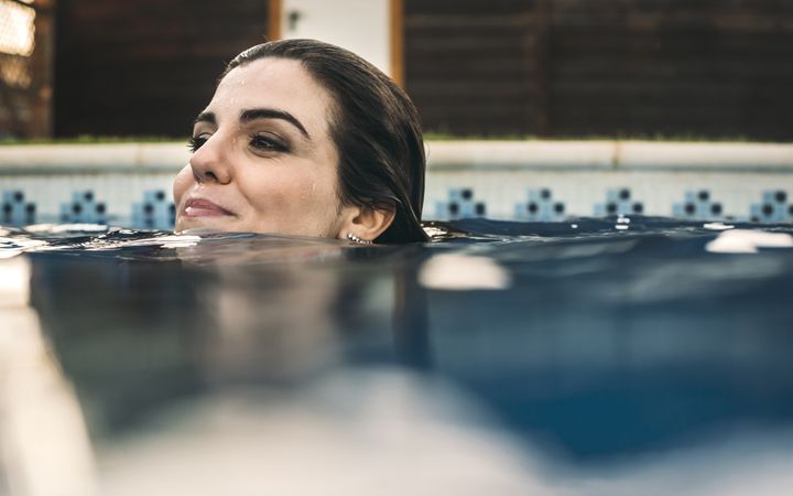 Happy woman in pool