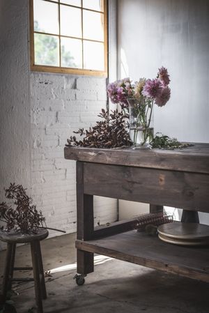 Bunches of flowers in vases on table