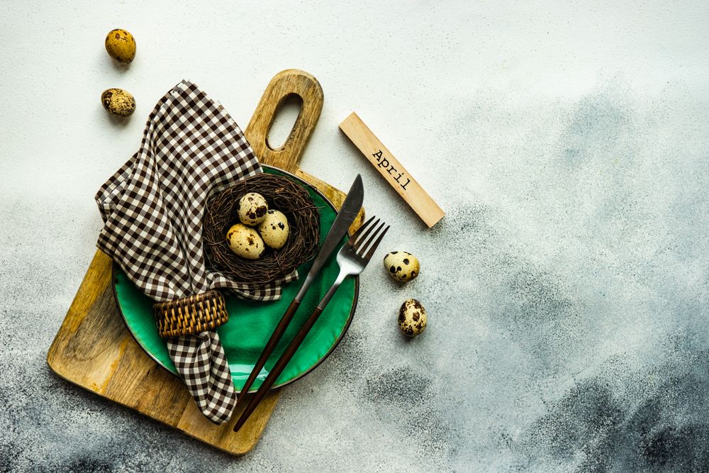 Easter table setting with decorative speckled quail eggs