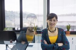Confident businesswoman standing in office