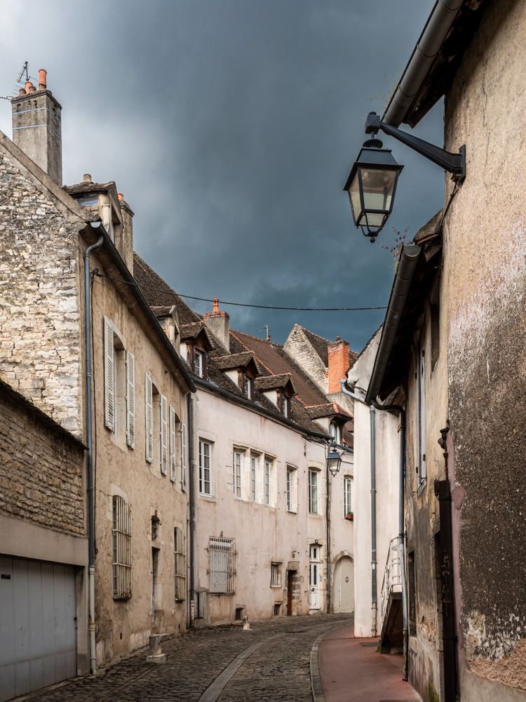 Empty streets of the medieval city of Beaune in Burgundy. The stormy sky