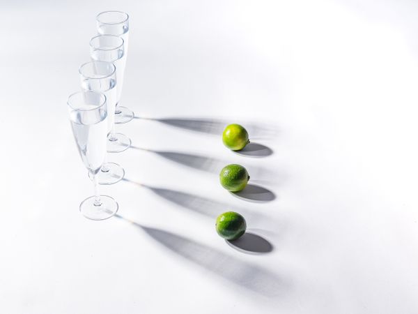 Creative composition of citrus and glasses of water