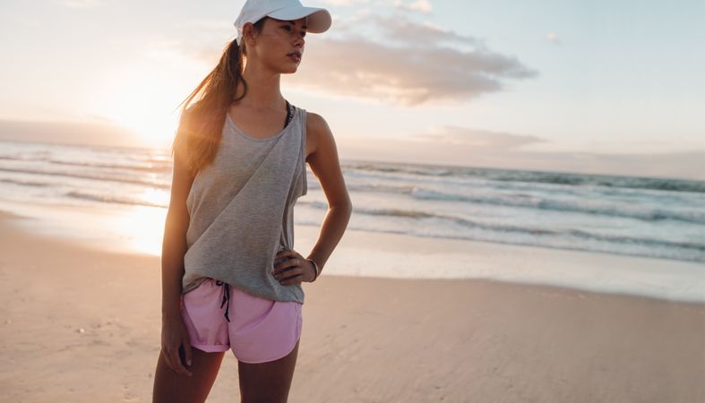 Healthy young woman standing on the beach