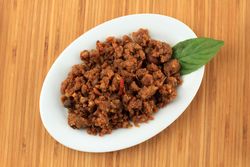 Top view of plate of tumis oncom, Indonesian dish of stir fried tempeh