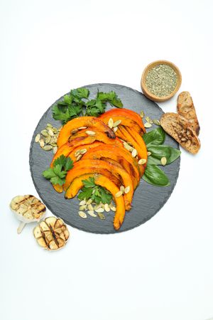 Concept of tasty homemade dish - baked pumpkin