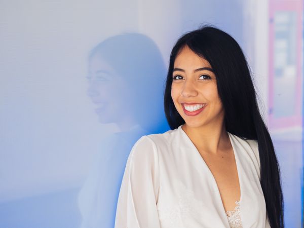 Young woman in beautiful dress smiling