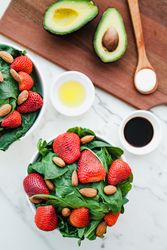 Strawberry served with almond and greenery