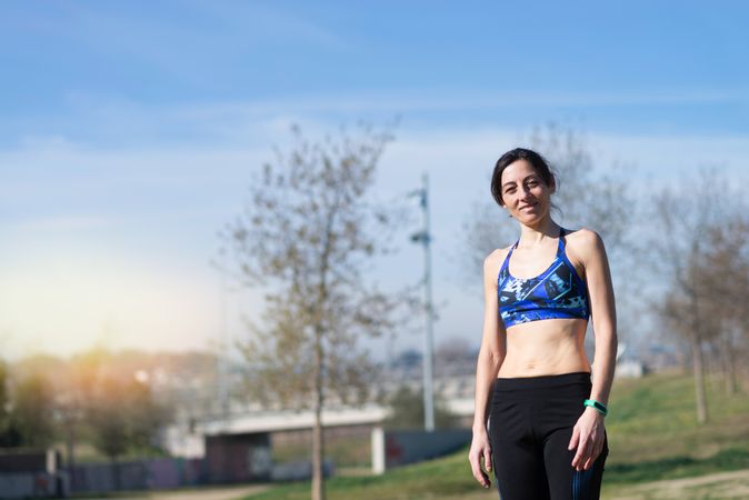 Smiling fit woman in park