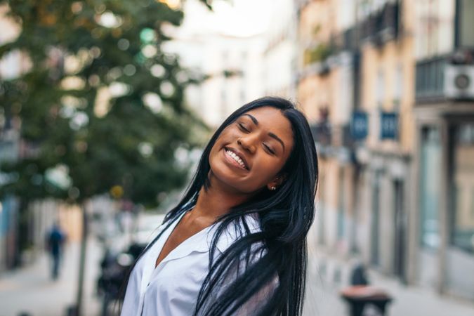 Portrait of a smiling Black Latina woman outdoors
