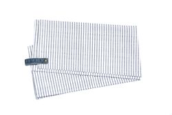 Folded fabric napkin isolated on plain background