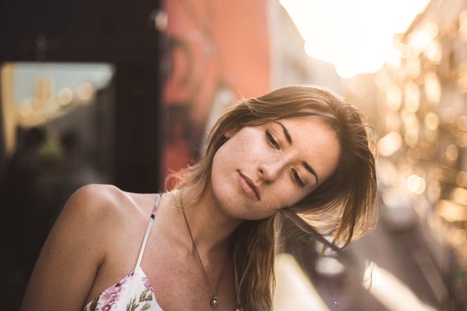 dreamy woman against sunny blurred background