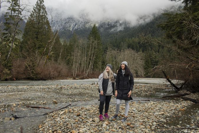 Two women looking up enjoying  mountain scenery