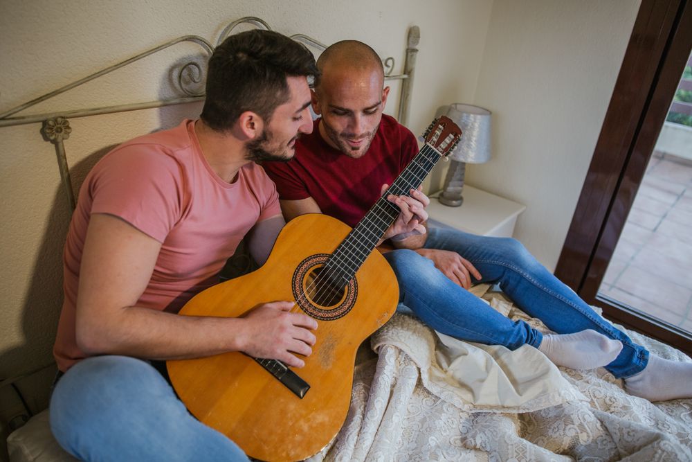 gay couple with guitar