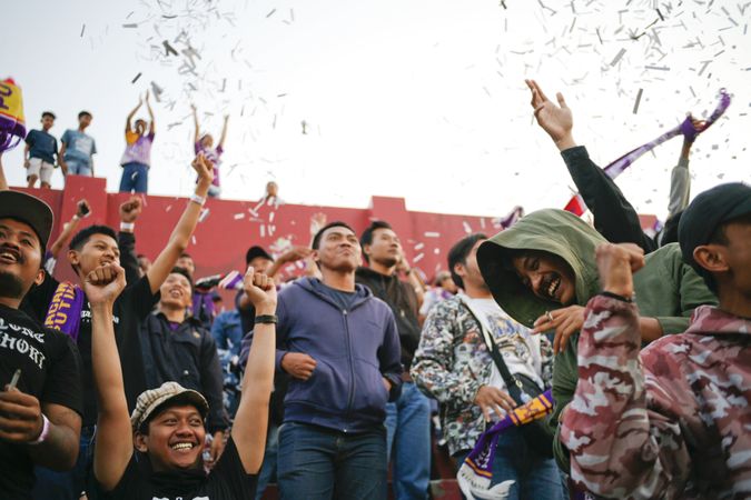 Kedira, East Java Indonesia - October 4, 2019: Happy fans celebrating in the stands