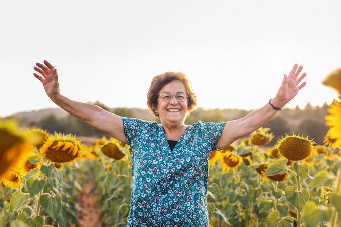 Mature woman in a field of sunflowers