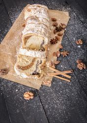 Top view of sponge cake with powdered sugar and spices
