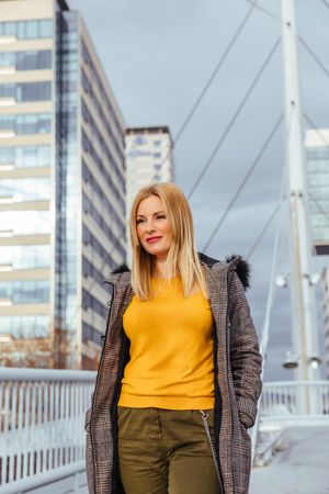 Blonde woman walking in the city