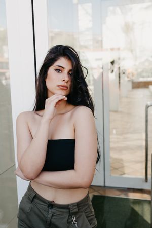 Woman posing near window