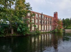 Building in the mill district on the Winnipesaukee River in Laconia, New Hampshire P5re70