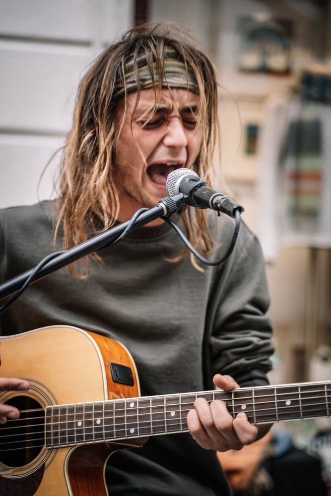 Male musician performing in the street