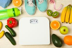 Healthy lifestyle accessories on neutral background, top view
