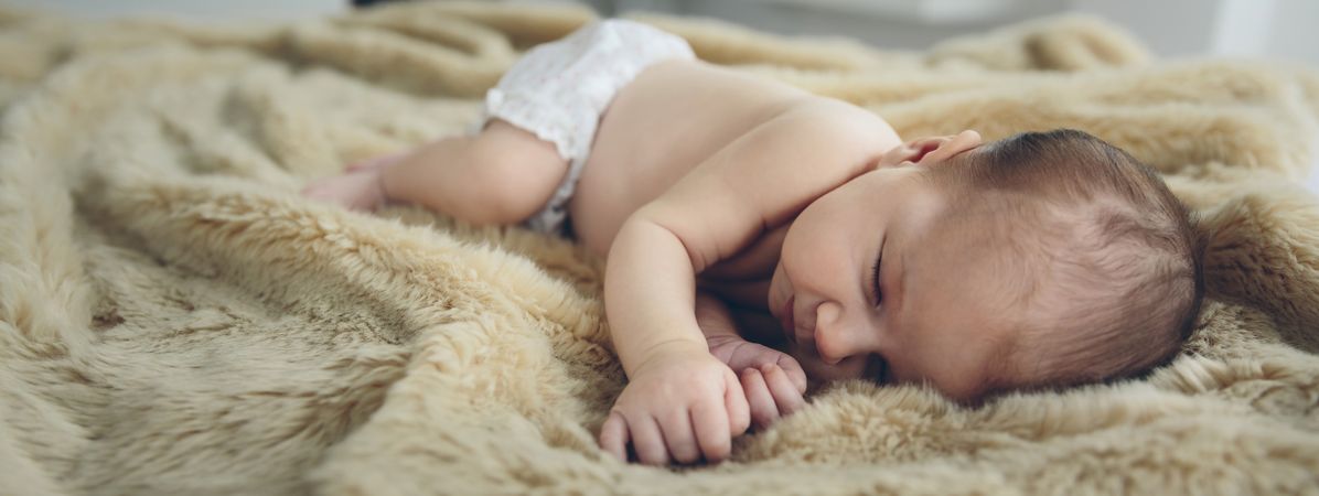Baby sleeping on a blanket