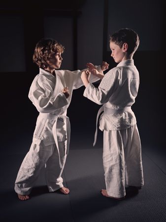 Boys practicing Krav Maga during training in studio