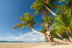 blonde resting on tropical seashore