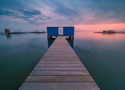 Wooden pier on cloudy evening