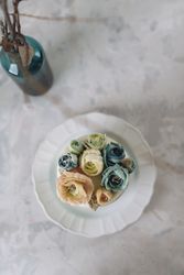 Buttercream flowers cake, blue and pastel peach colors