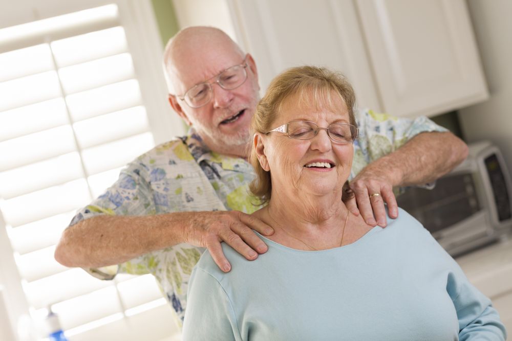 Adult Husband Giving Wife a Shoulder Rub
