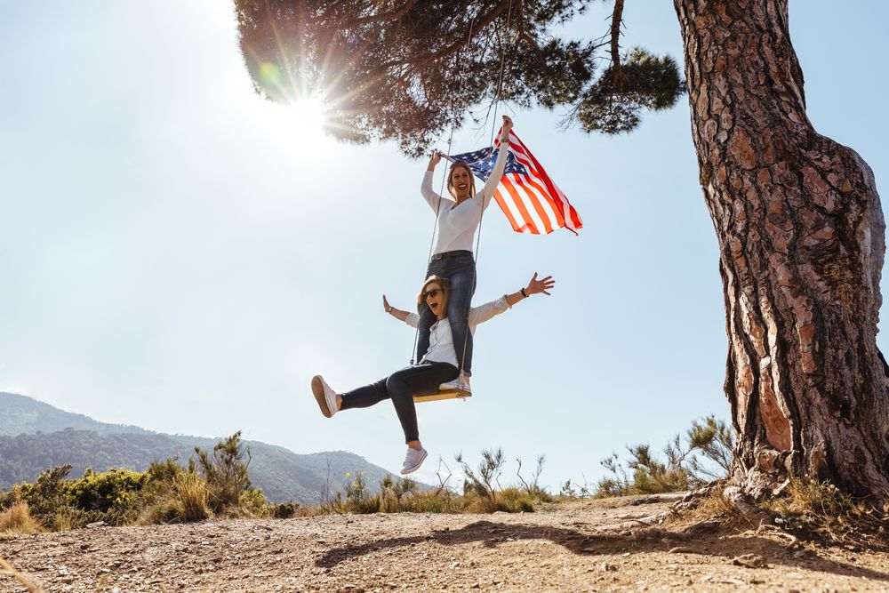 Two females with an American flag