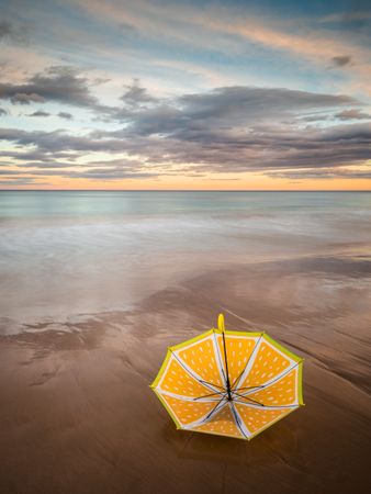 Umbrella on beach near sea