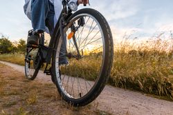 women on a bike in a field. close-up