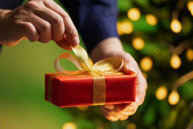 Man Holding Christmas Gift Box