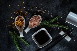 Asian table setting with chopsticks and herbs