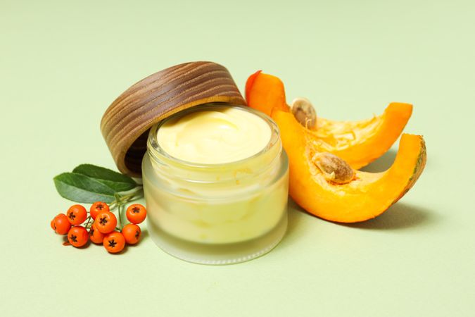 Skin care and face care concept - pumpkin cosmetic