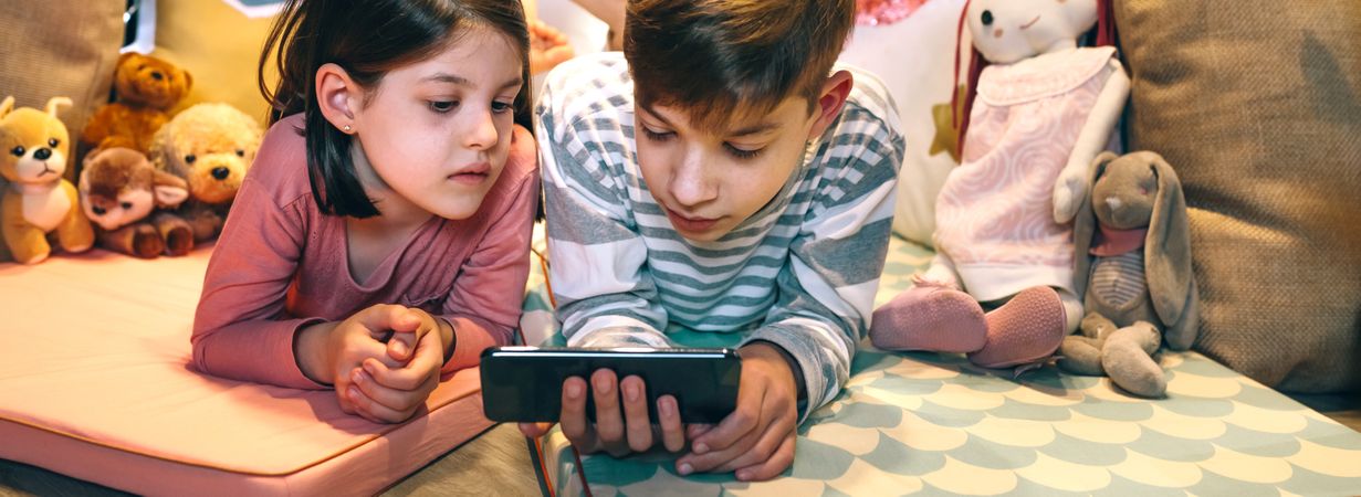 Banner of children watching unsafe content on cellphone without parental supervision at home