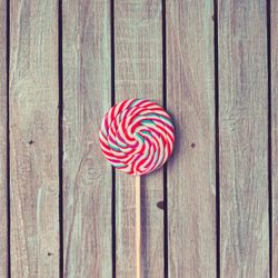Large swirling lollipop on wood background