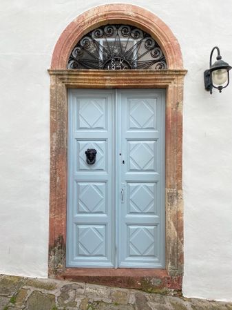 Patmian blue door with arch window and street lantern