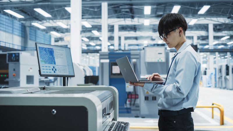 Asian man with his computer at electronics store check out